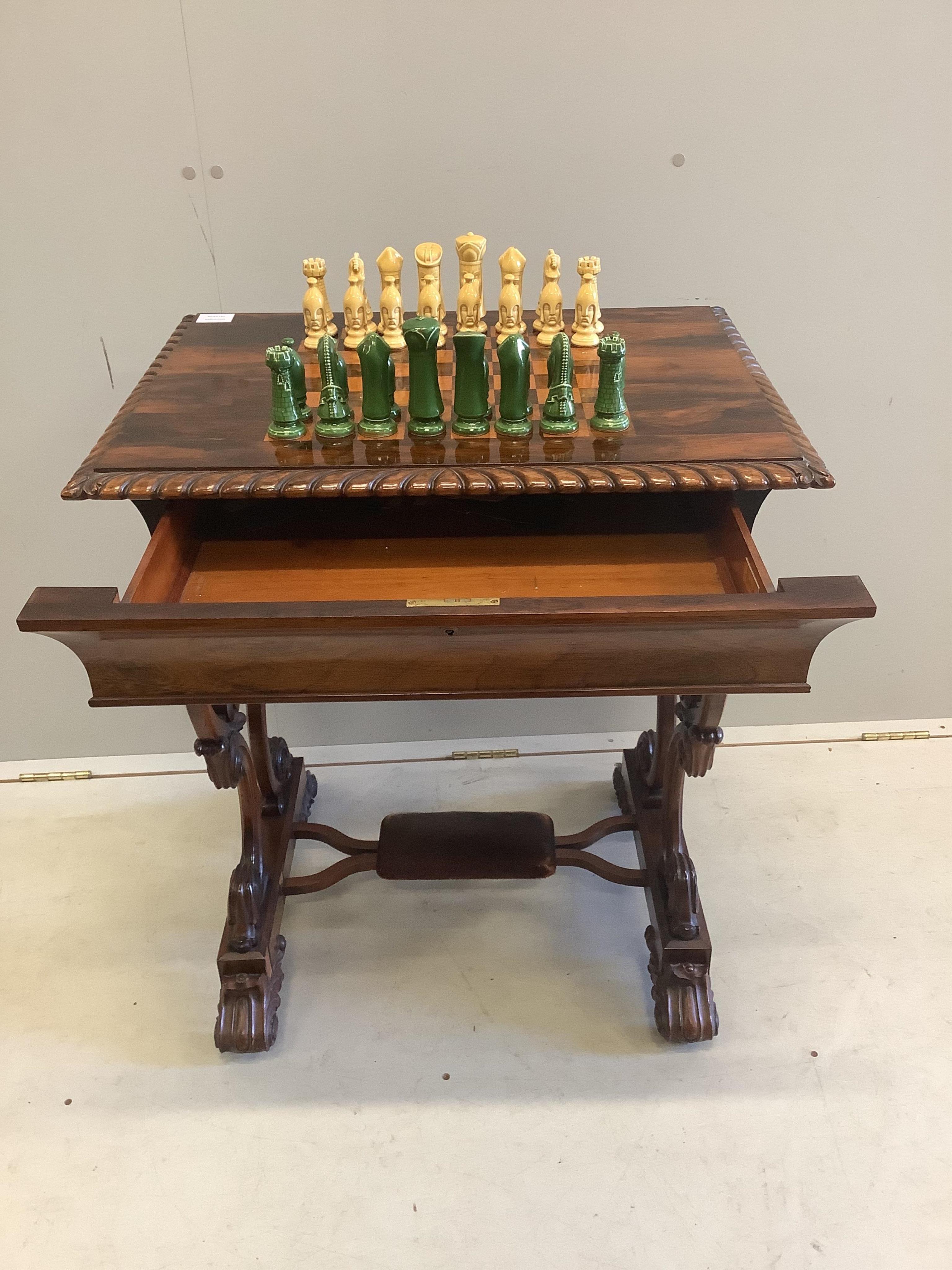 A Victorian rosewood chess top table, with chess pieces, width 66cm, depth 50cm, height 76cm